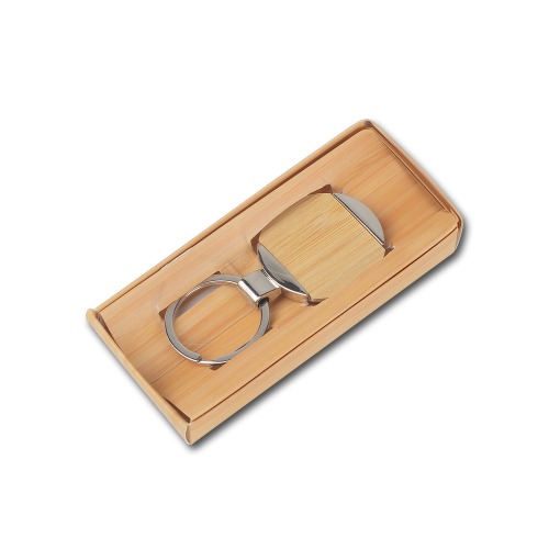 Chaveiro redondo de metal e bambu. 7,2x3,8cm