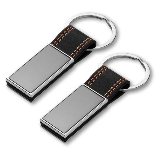 Chaveiro de metal em níquel brilhante + PU. 8,5x3cm